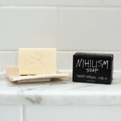 Nihilism Soap removed from its packaging, showing the unscented novelty bar and humorous philosophy-themed design.