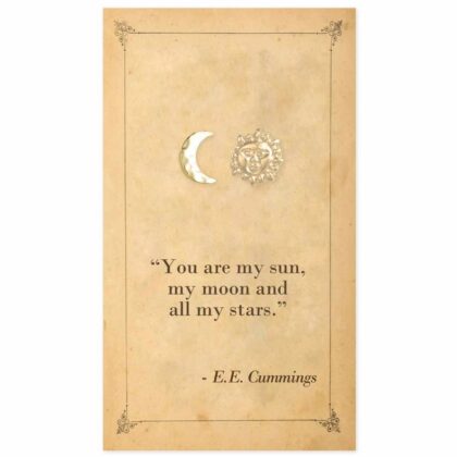 Gold-tone sun and moon stud earrings displayed on a vintage-style literary card featuring a quote by E. E. Cummings.