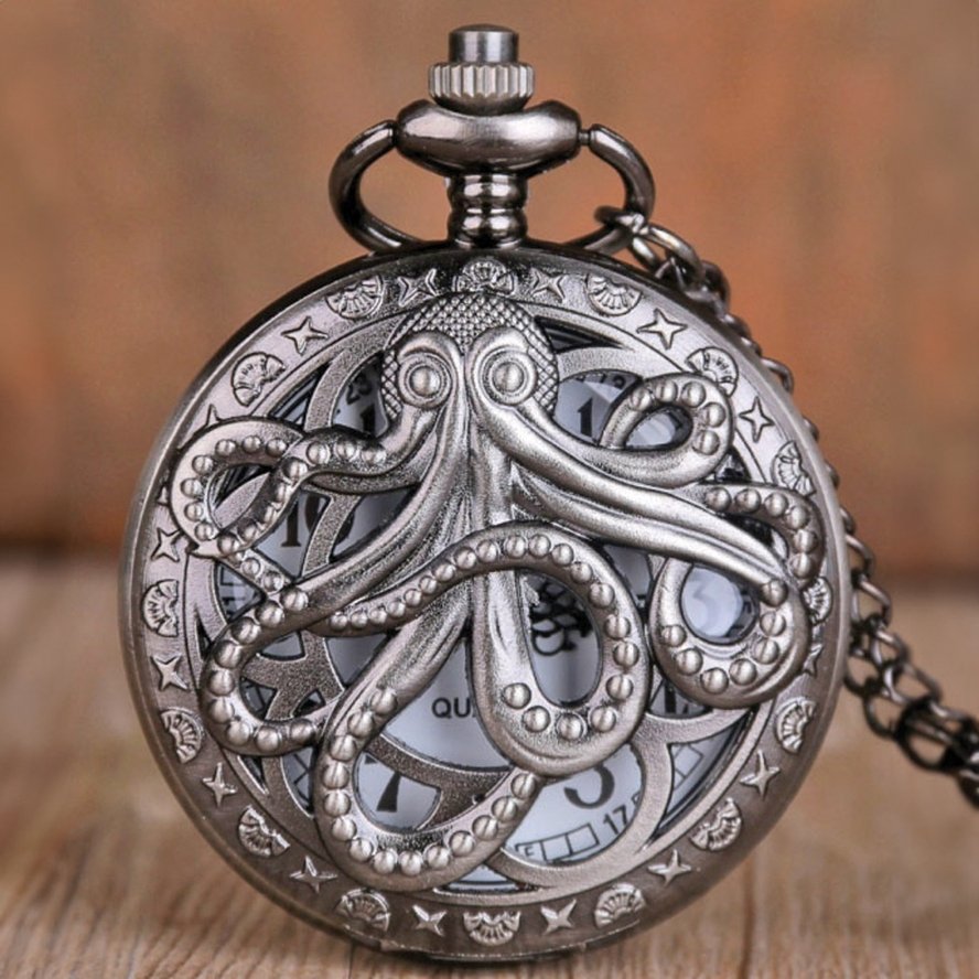 Close-up of the octopus design on a vintage-style silver-tone pocket watch necklace.