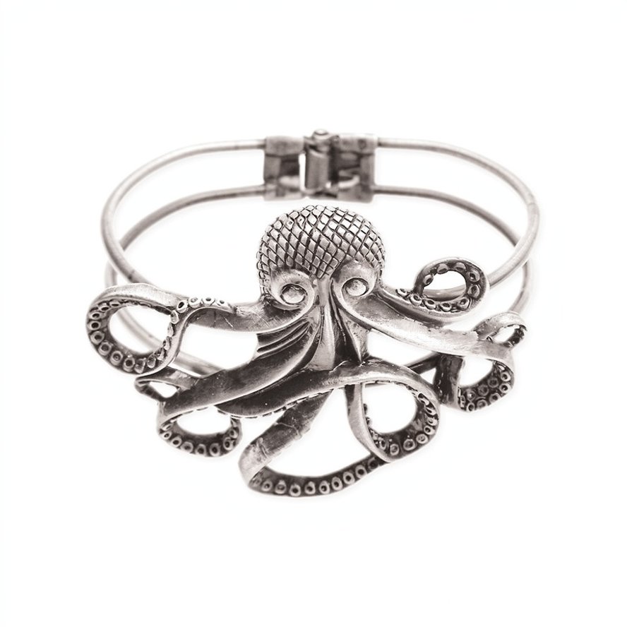 Silver-tone hinged cuff bracelet featuring a large sculpted octopus with outstretched curling tentacles and detailed suction cups against a white background.